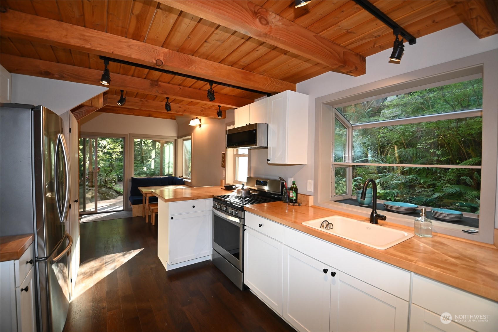 52016 South Riverside Road Gold Bar, WA 98251 - Photo 26 of 39 a kitchen with a sink and large window