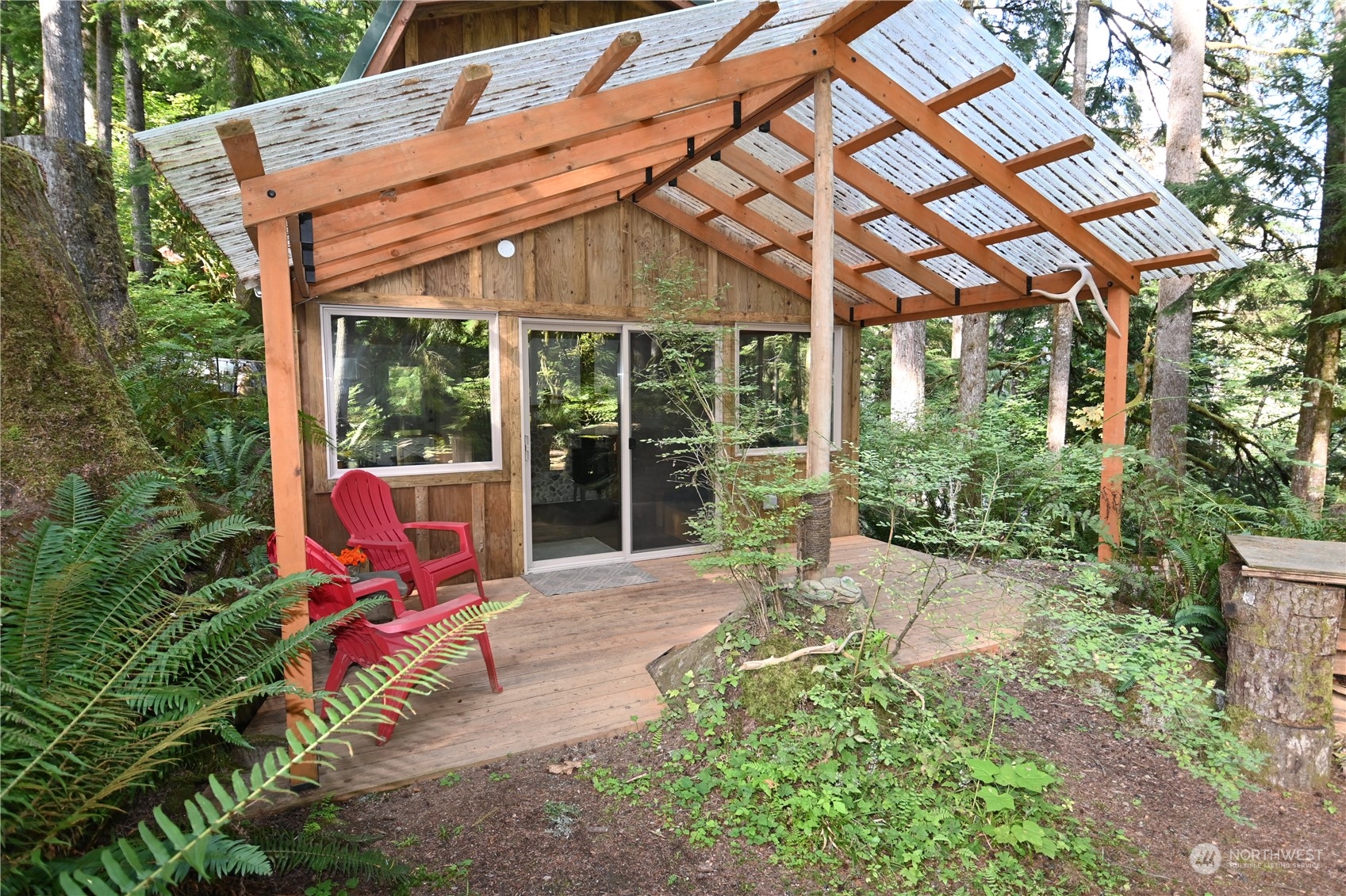 52016 South Riverside Road Gold Bar, WA 98251 - Photo 7 of 39 a backyard of a house with outdoor seating