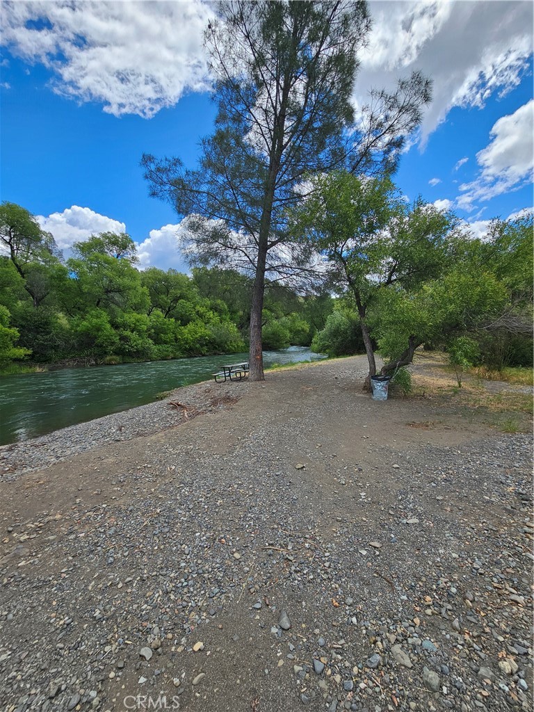 3144 Spring Valley Road Clearlake Oaks, CA 95423 - Photo 9 of 9 a view of a dirt road with a building in the background