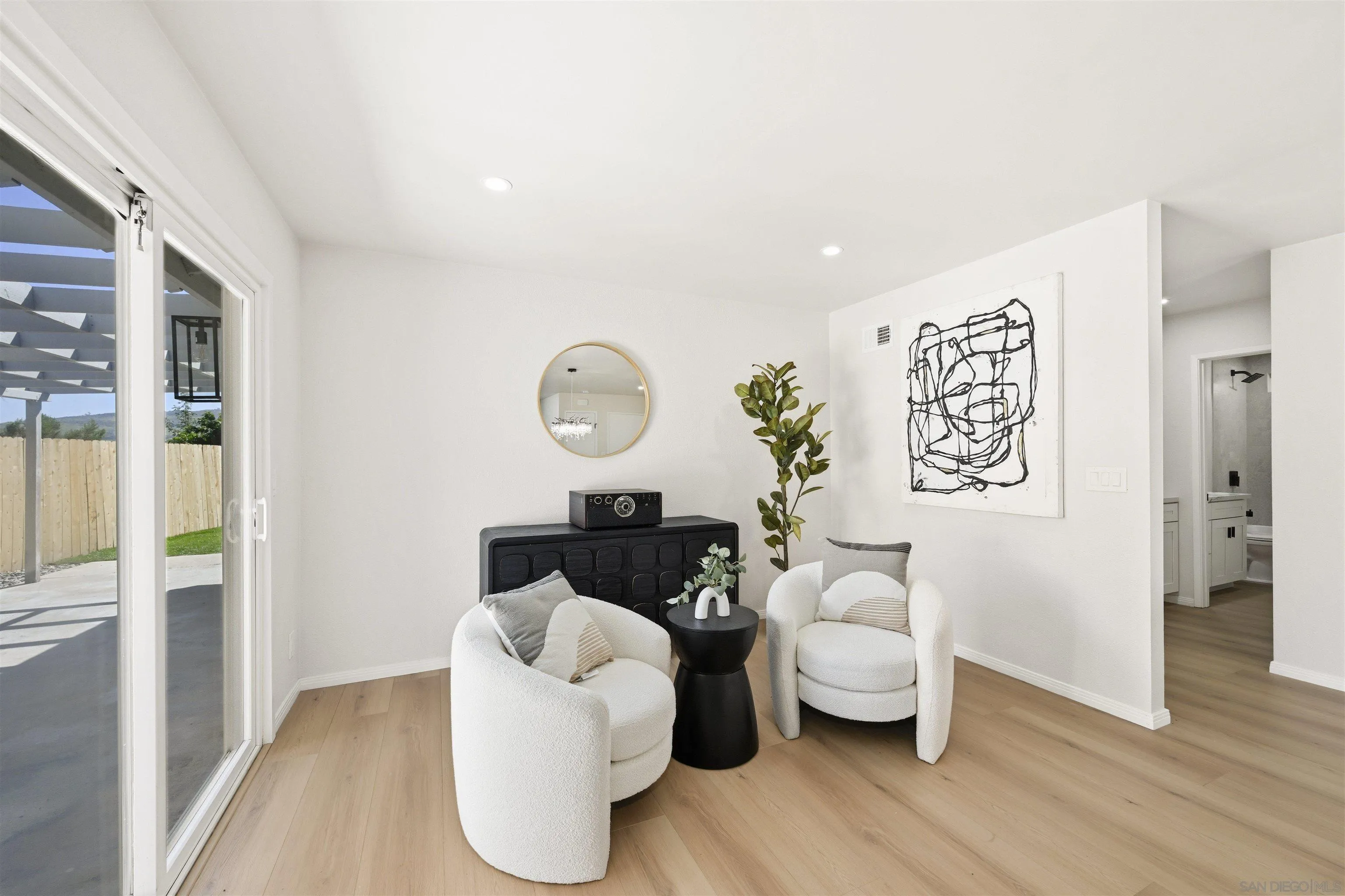 12437 Ridgeton Drive Lakeside, CA 92040 - Photo 11 of 32 a living room with furniture and a wooden floor