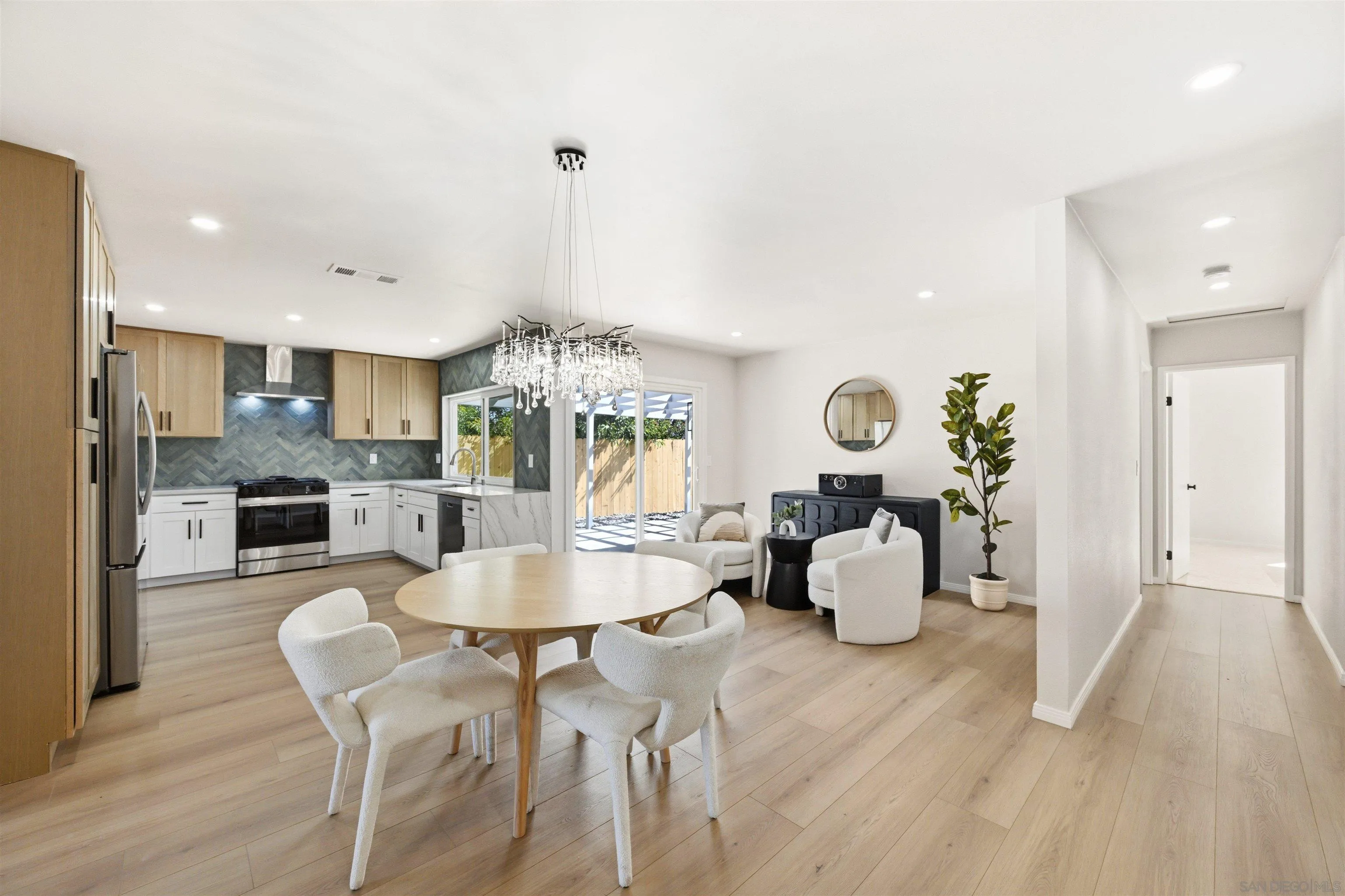 12437 Ridgeton Drive Lakeside, CA 92040 - Photo 14 of 32 a large kitchen with a table and chairs