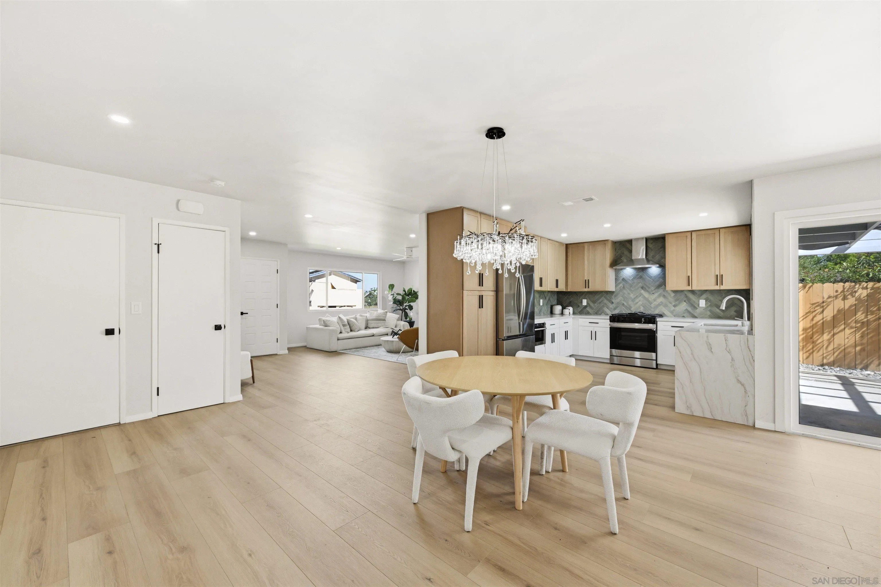 12437 Ridgeton Drive Lakeside, CA 92040 - Photo 15 of 32 a kitchen with a table and chairs in it
