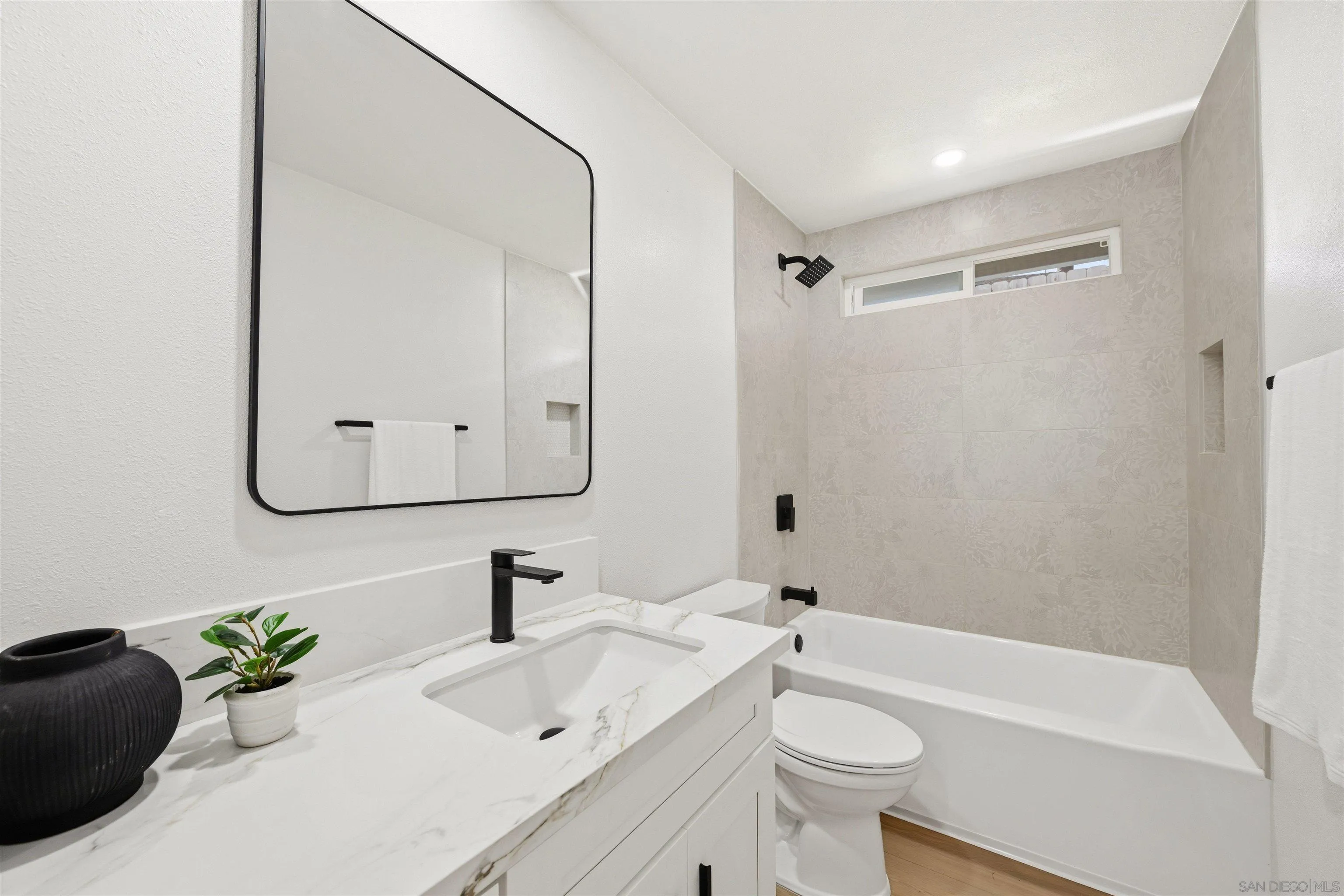 12437 Ridgeton Drive Lakeside, CA 92040 - Photo 17 of 32 a bathroom with a sink a toilet and shower