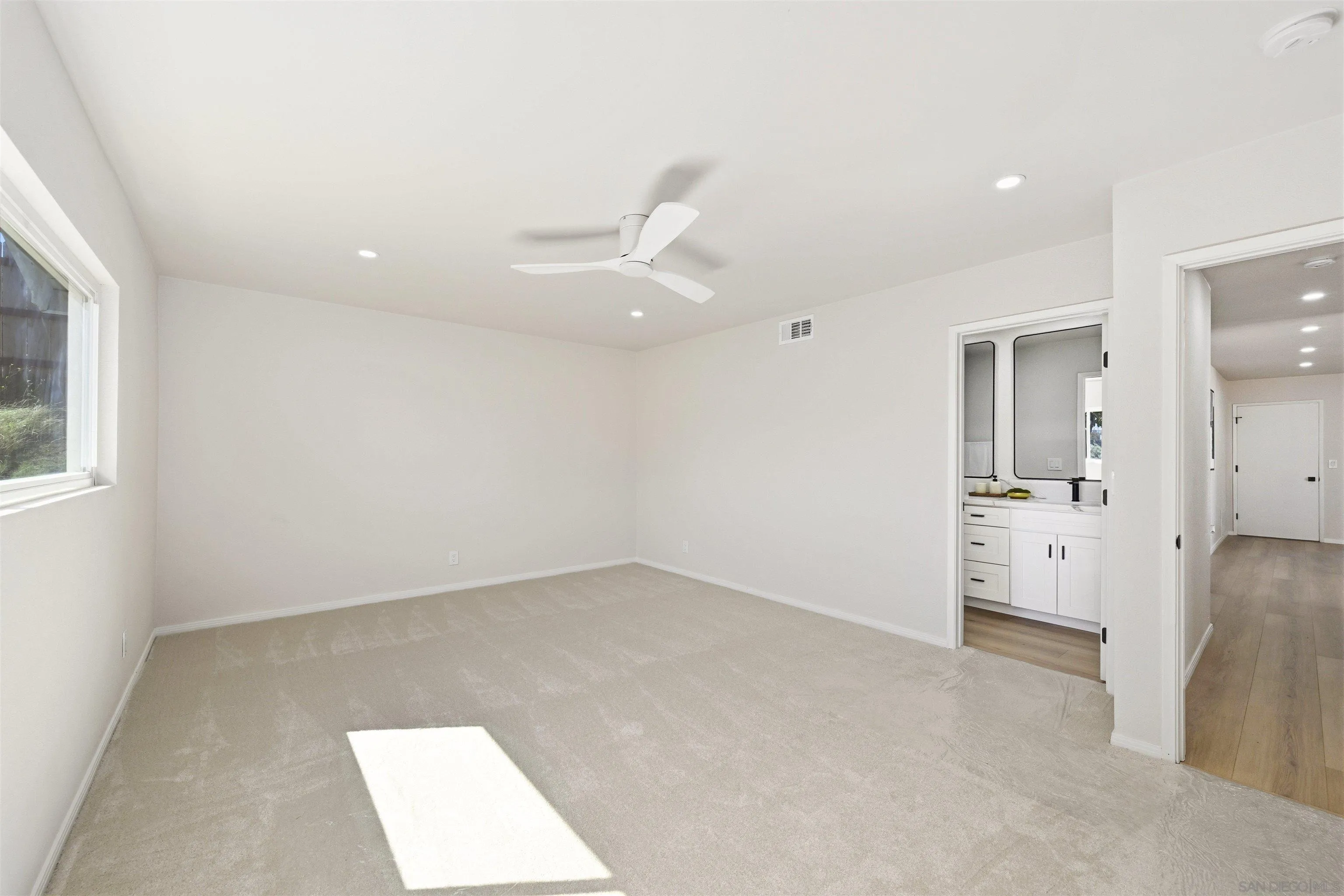 12437 Ridgeton Drive Lakeside, CA 92040 - Photo 22 of 32 an empty room with a bathroom and mirror