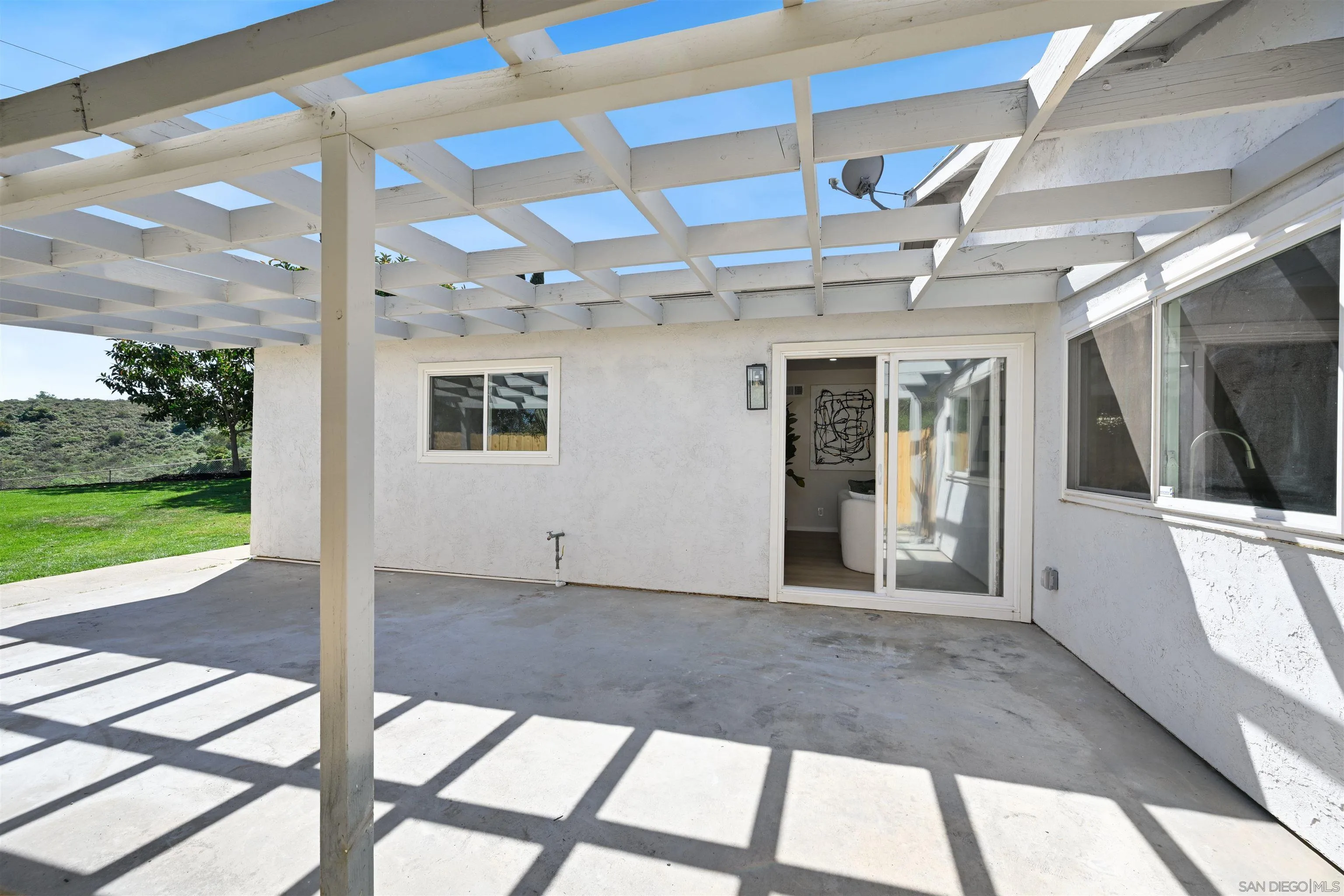 12437 Ridgeton Drive Lakeside, CA 92040 - Photo 25 of 32 a view of a porch with a floor to ceiling window and an outdoor space