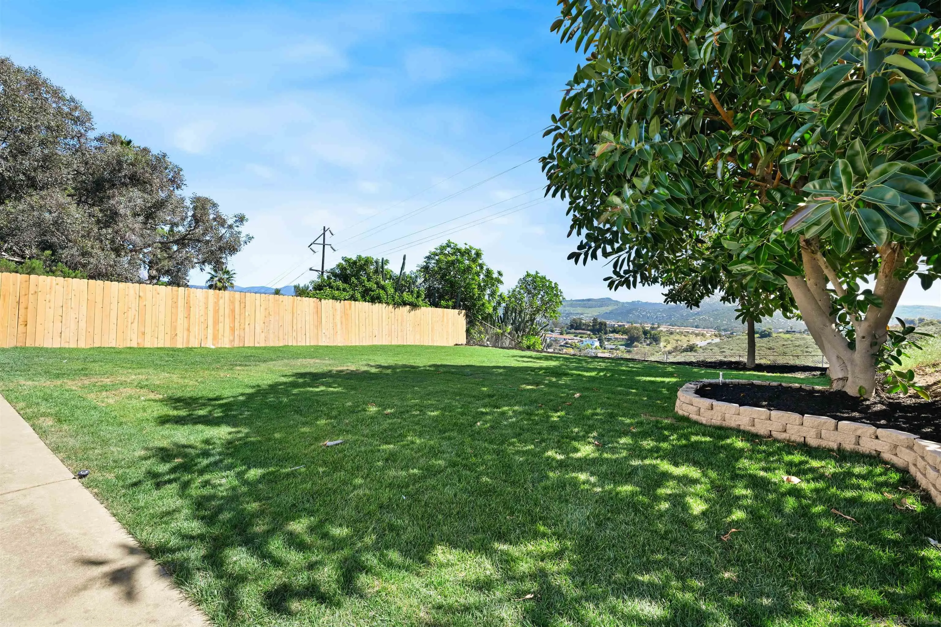 12437 Ridgeton Drive Lakeside, CA 92040 - Photo 28 of 32 a view of yard with swimming pool and green space
