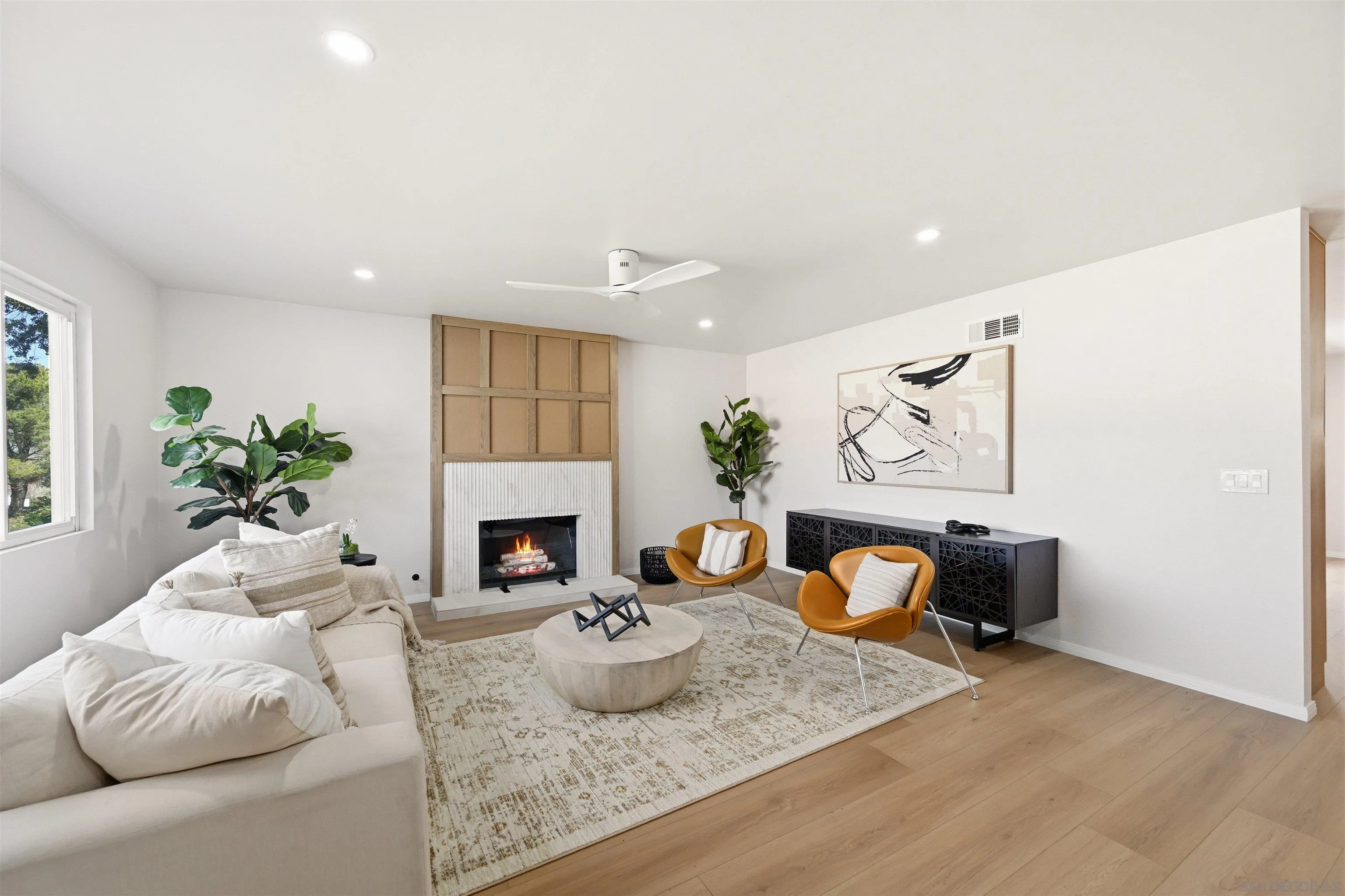 12437 Ridgeton Drive Lakeside, CA 92040 - Photo 7 of 32 a living room with furniture potted plant and a fireplace