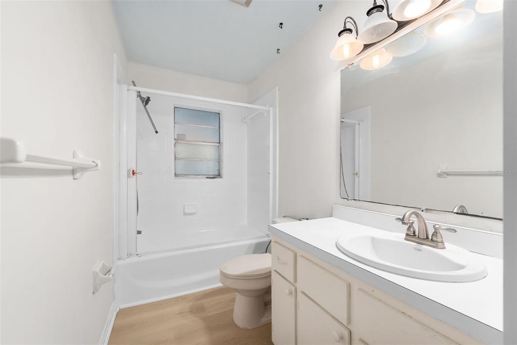 4825 Southwest 19th Street Gainesville, FL 32608 - Photo 23 of 40 a bathroom with a sink toilet and shower