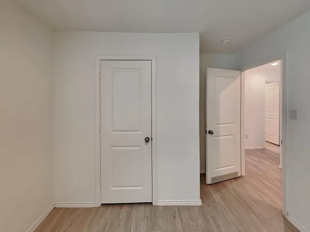 a view of a livingroom with wooden floor