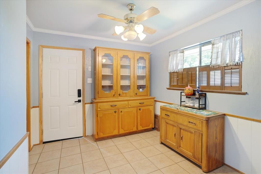 1418 Blanton Place Sherman, TX 75092 - Photo 13 of 33 a kitchen with a stove a sink and a refrigerator