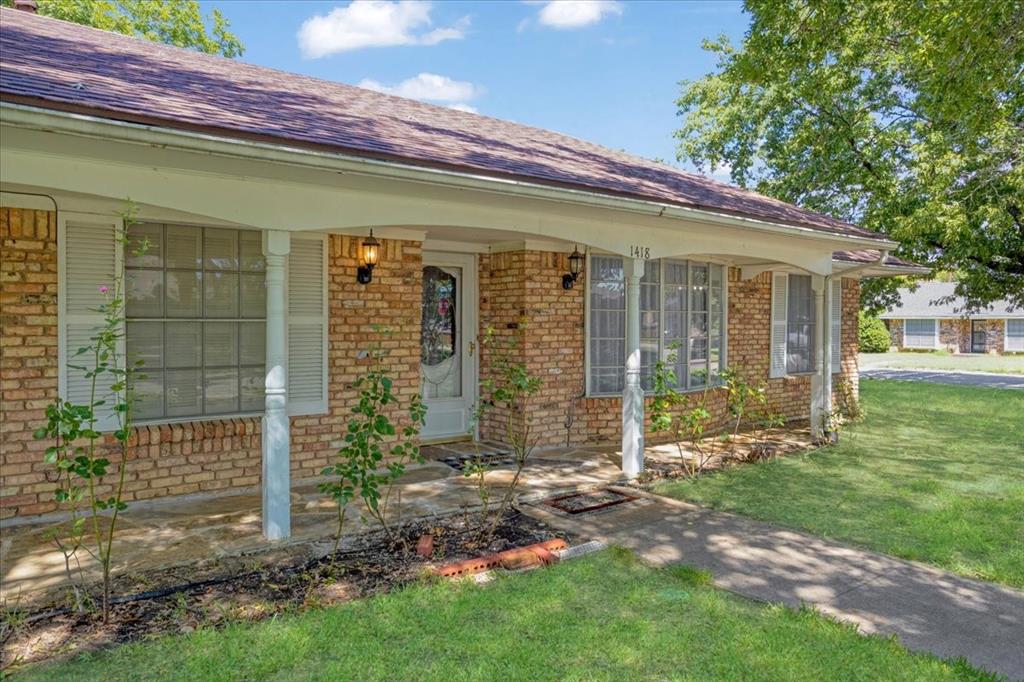 1418 Blanton Place Sherman, TX 75092 - Photo 2 of 33 a view of a house with a yard