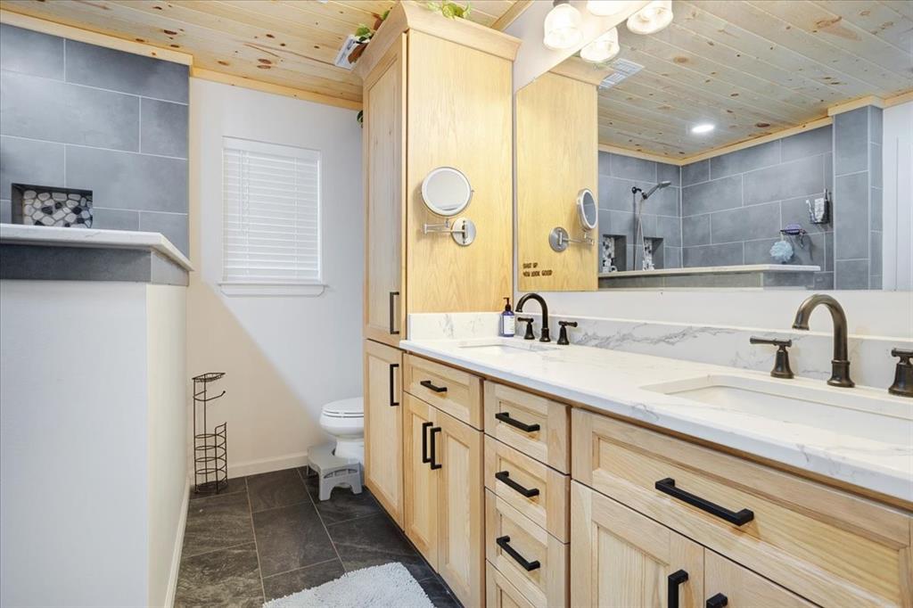 1418 Blanton Place Sherman, TX 75092 - Photo 23 of 33 a bathroom with a double vanity sink mirror and shower
