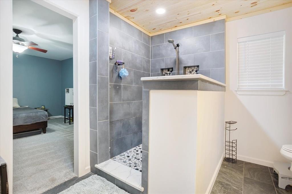 1418 Blanton Place Sherman, TX 75092 - Photo 25 of 33 a bathroom with a sink a toilet and shower