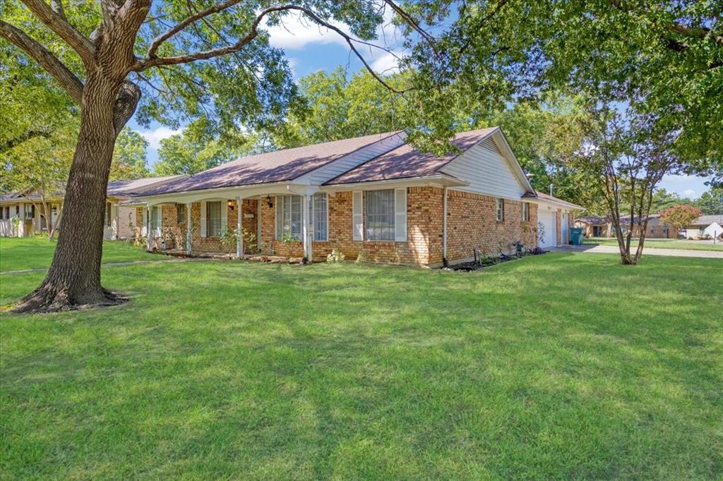 1418 Blanton Place Sherman, TX 75092 - Photo 31 of 33 a view of a house with a big yard potted plants and large tree