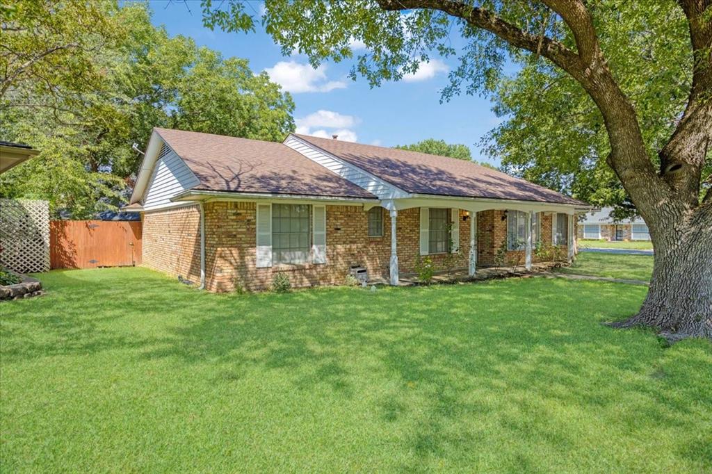 1418 Blanton Place Sherman, TX 75092 - Photo 32 of 33 a front view of a house with a garden