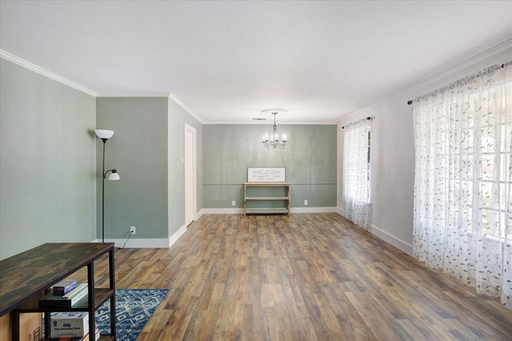 1418 Blanton Place Sherman, TX 75092 - Photo 4 of 33 a view of a room with wooden floor lounge chair and windows