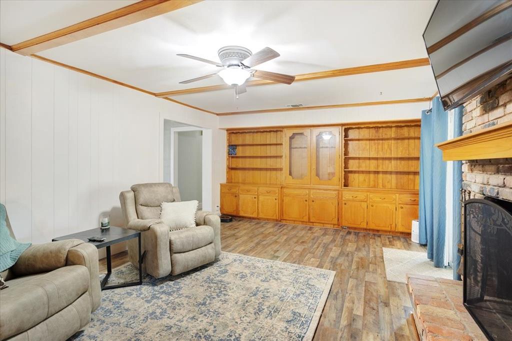 1418 Blanton Place Sherman, TX 75092 - Photo 6 of 33 a living room with furniture and a fireplace