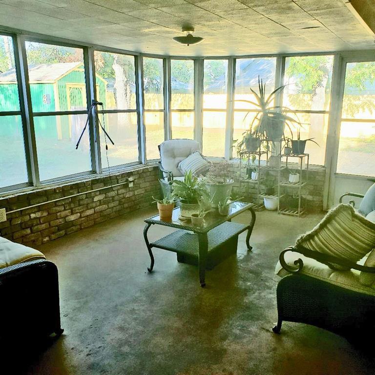 1418 Blanton Place Sherman, TX 75092 - Photo 8 of 33 a living room with furniture and a floor to ceiling window