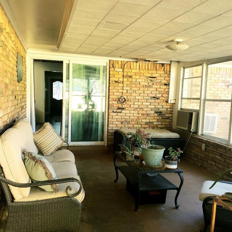 1418 Blanton Place Sherman, TX 75092 - Photo 9 of 33 a living room with furniture and floor to ceiling windows
