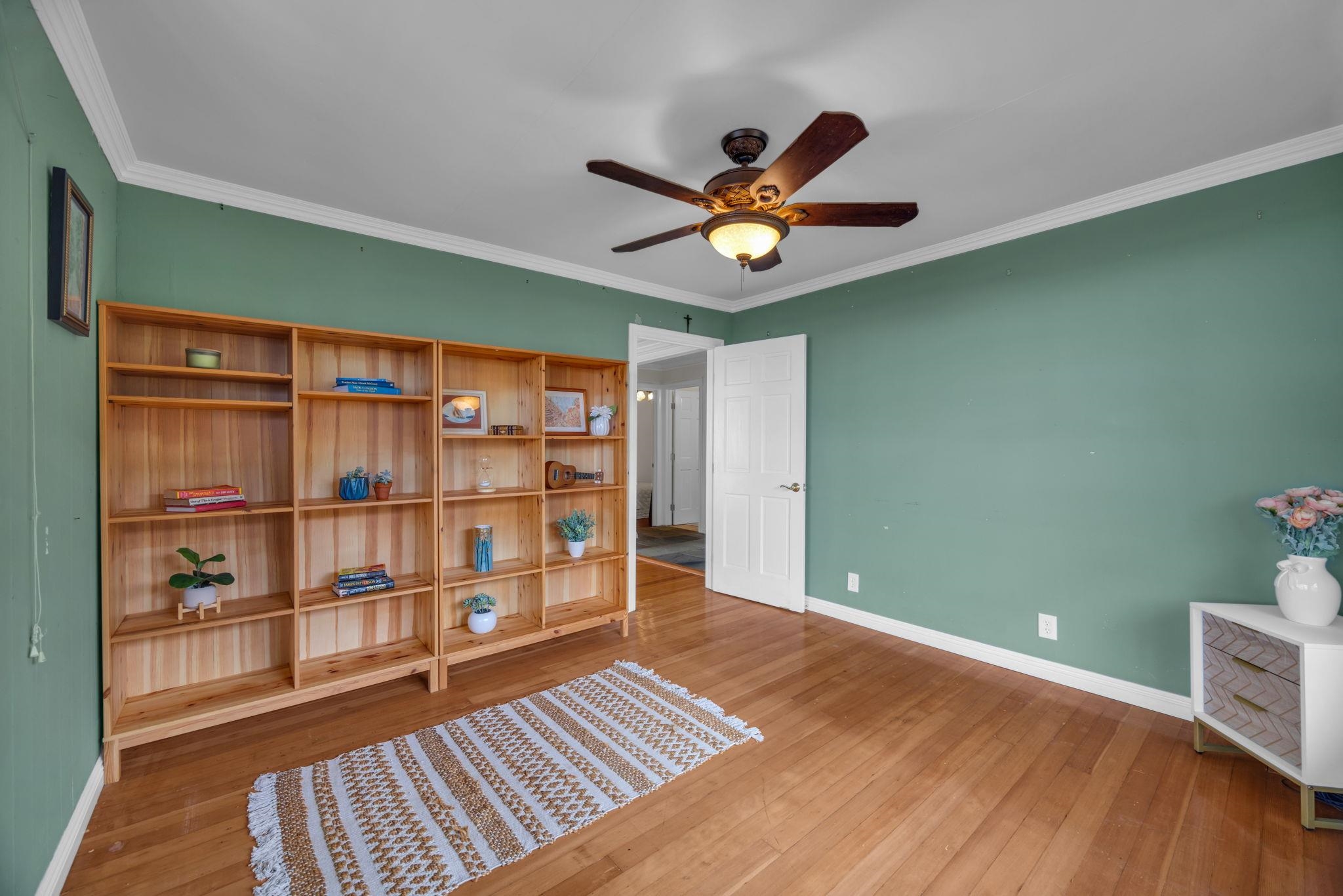 1123 Kehau Place Makawao, HI 96768 - Photo 22 of 50 a view of a room with wooden floor and ceiling fan