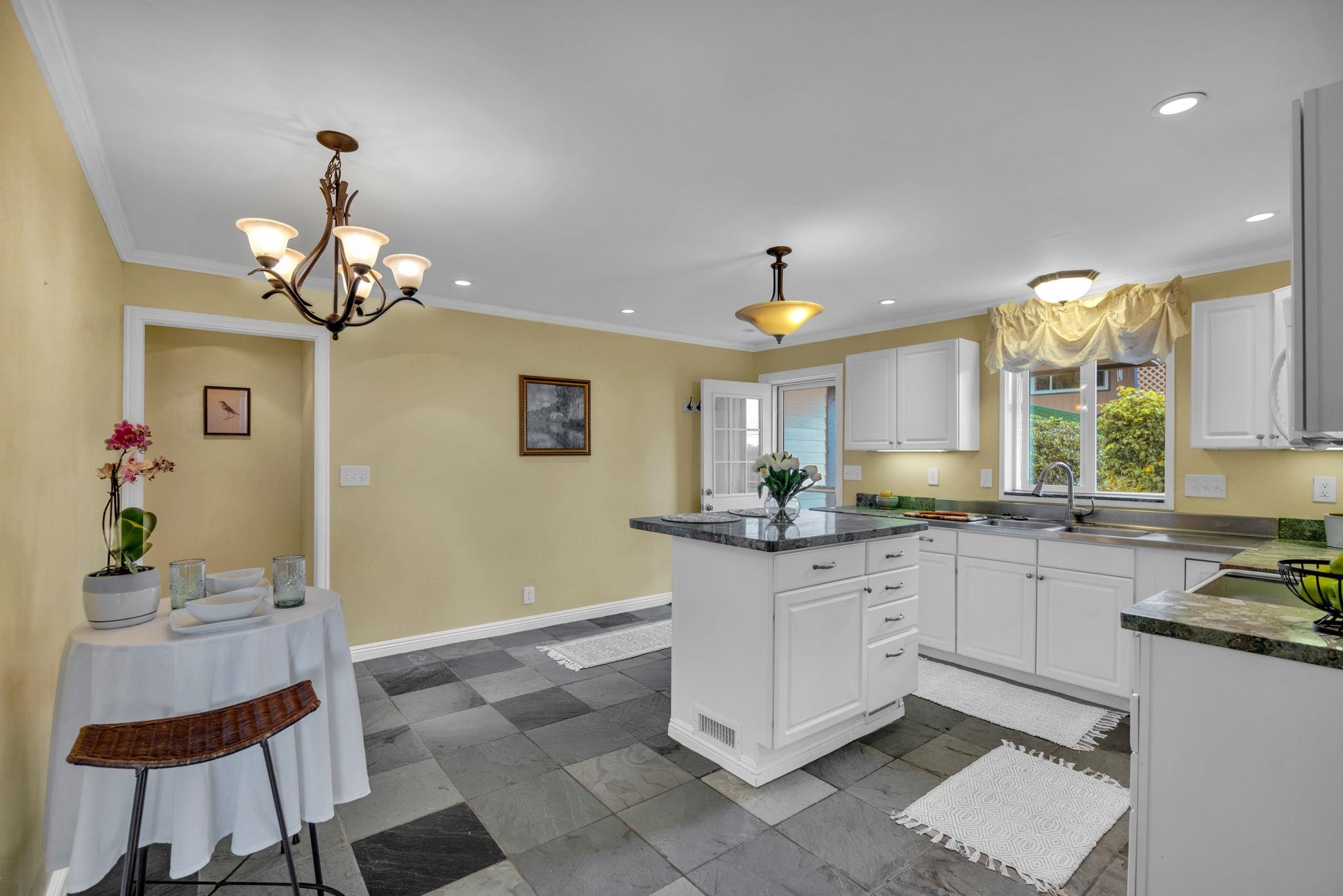 1123 Kehau Place Makawao, HI 96768 - Photo 23 of 50 a kitchen with granite countertop white cabinets and stainless steel appliances