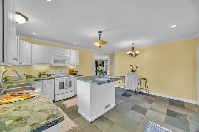 a view of a livingroom with furniture and wooden floor