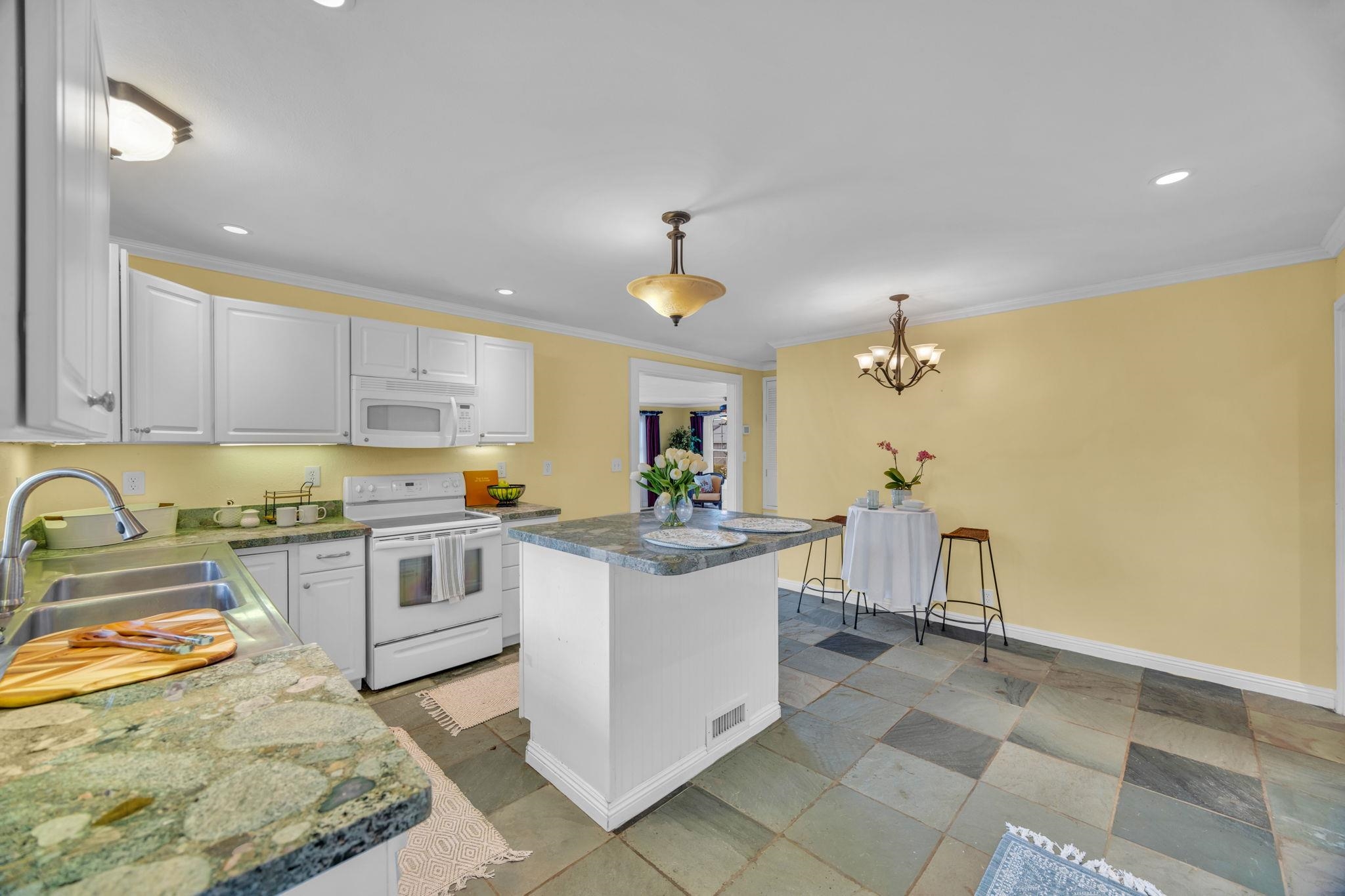 1123 Kehau Place Makawao, HI 96768 - Photo 27 of 50 a kitchen with stainless steel appliances granite countertop a sink and cabinets