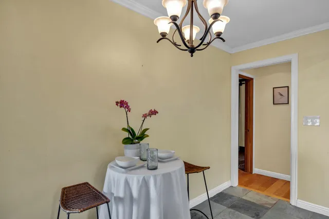 a kitchen with stainless steel appliances granite countertop a sink and a white cabinets