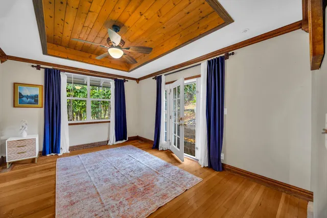 a view of a room with window and wooden floor