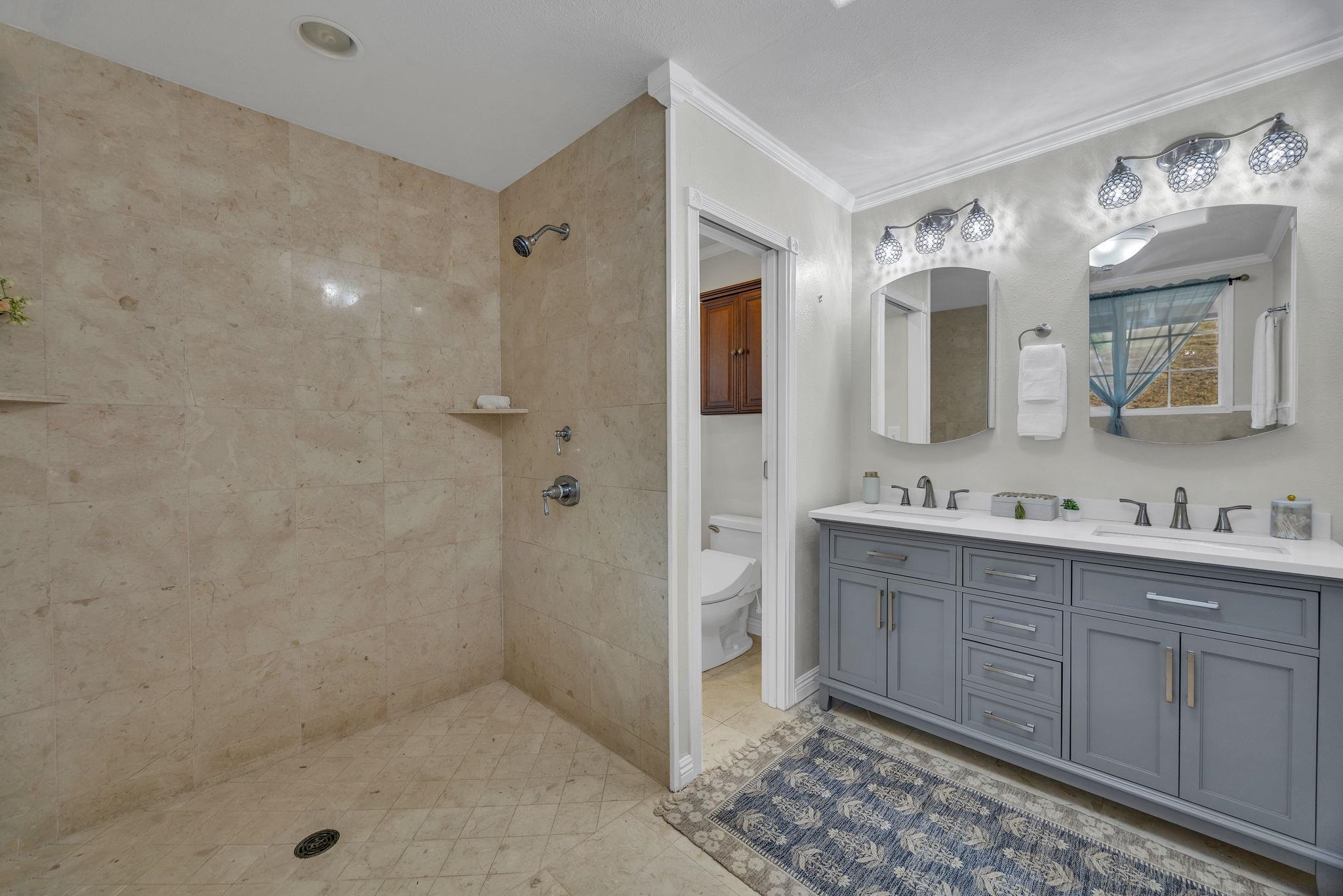 1123 Kehau Place Makawao, HI 96768 - Photo 34 of 50 a bathroom with a double vanity sink mirror and shower