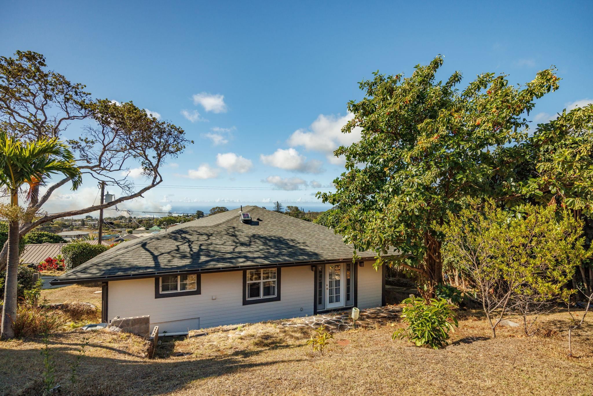 1123 Kehau Place Makawao, HI 96768 - Photo 46 of 50 a view of a house with a tree and a yard