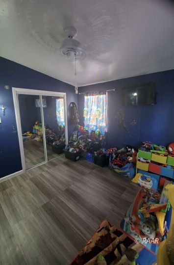 425 North Norma Street Ridgecrest, CA 93555 - Photo 22 of 33 a view of a room with toys and wooden floor