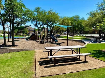 a view of a park with sitting area