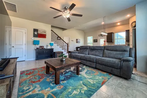 a living room with furniture and a rug