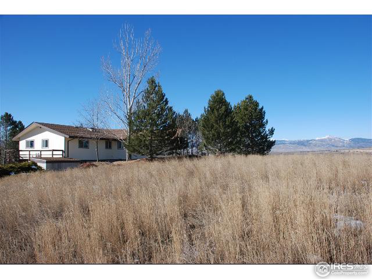 9251 Valmont Road Boulder, CO 80301 - Photo 3 of 14 a view of a house with a big yard