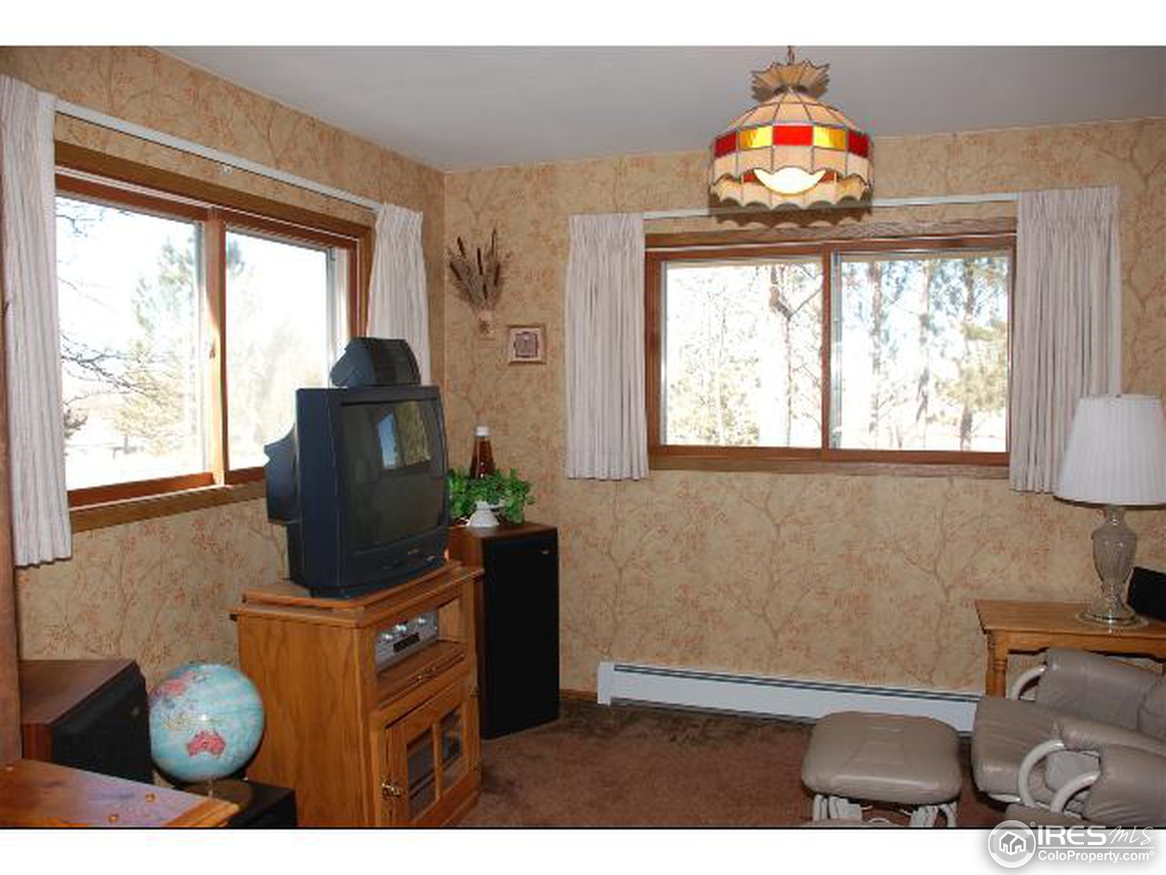 9251 Valmont Road Boulder, CO 80301 - Photo 7 of 14 a living room with furniture and a window