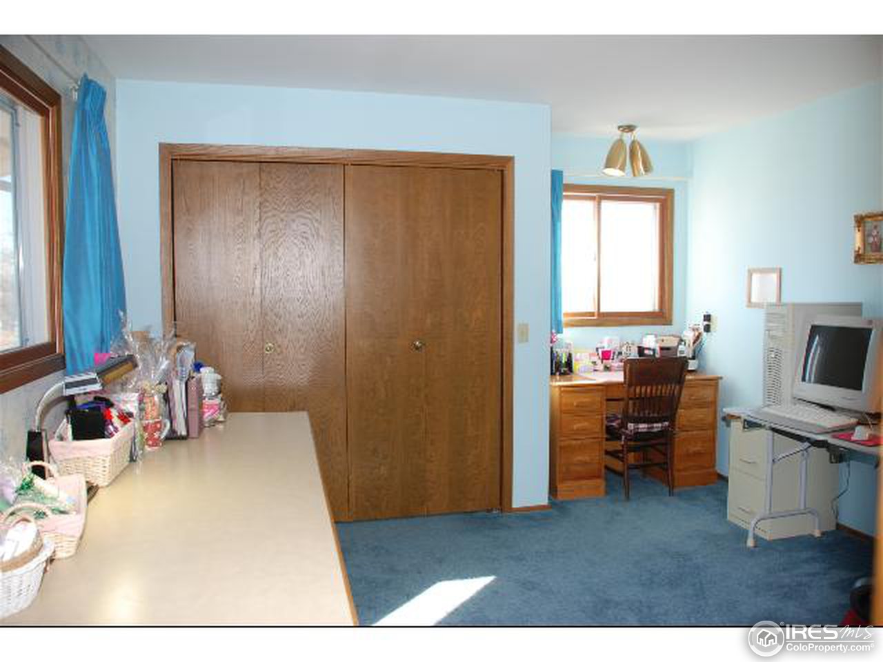 9251 Valmont Road Boulder, CO 80301 - Photo 10 of 14 a bedroom with a bed and a tv
