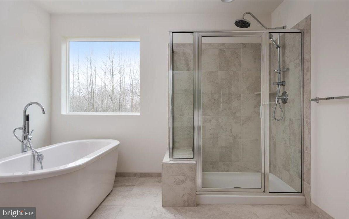 201 Featherstone Road Pasadena, MD 21122 - Photo 11 of 19 a bathroom with a bathtub and a shower