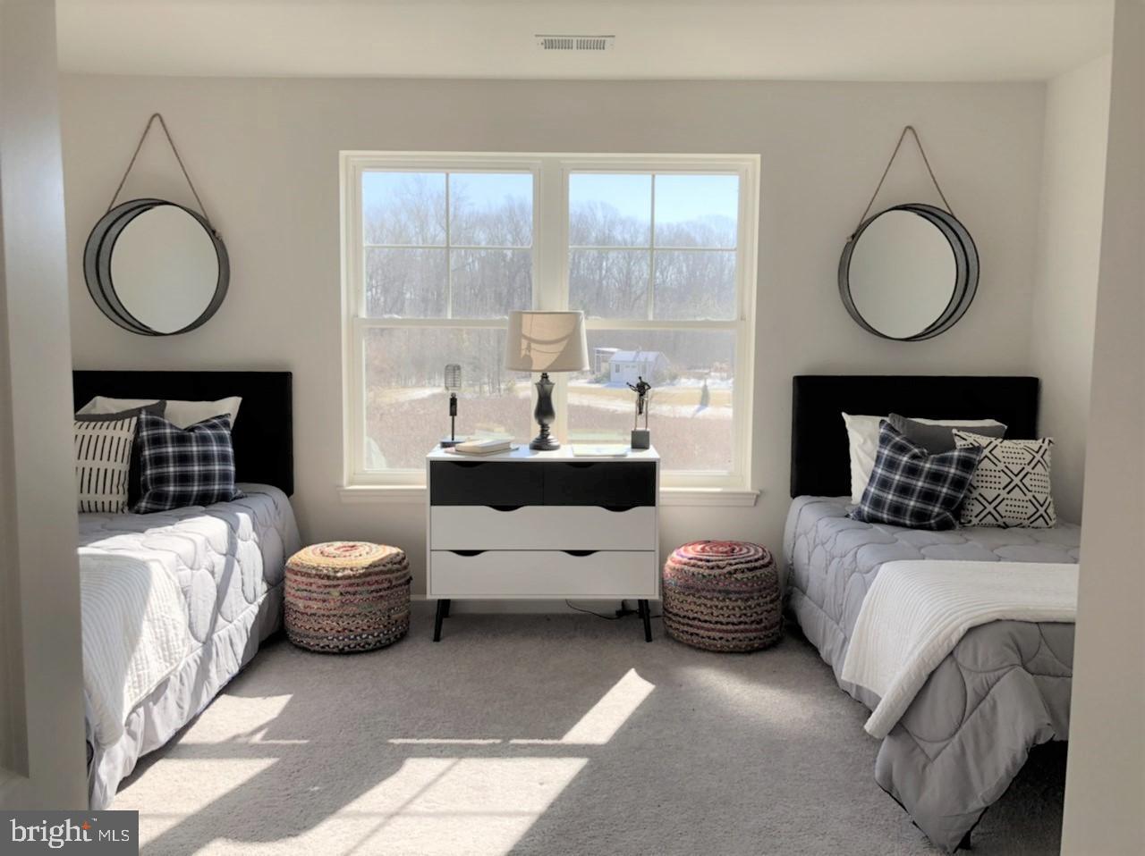 201 Featherstone Road Pasadena, MD 21122 - Photo 15 of 19 a living room with furniture a mirror and a fireplace