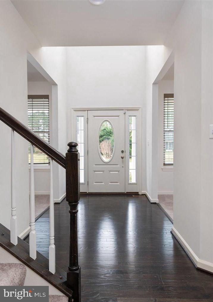 201 Featherstone Road Pasadena, MD 21122 - Photo 2 of 19 a view of an entryway with wooden floor