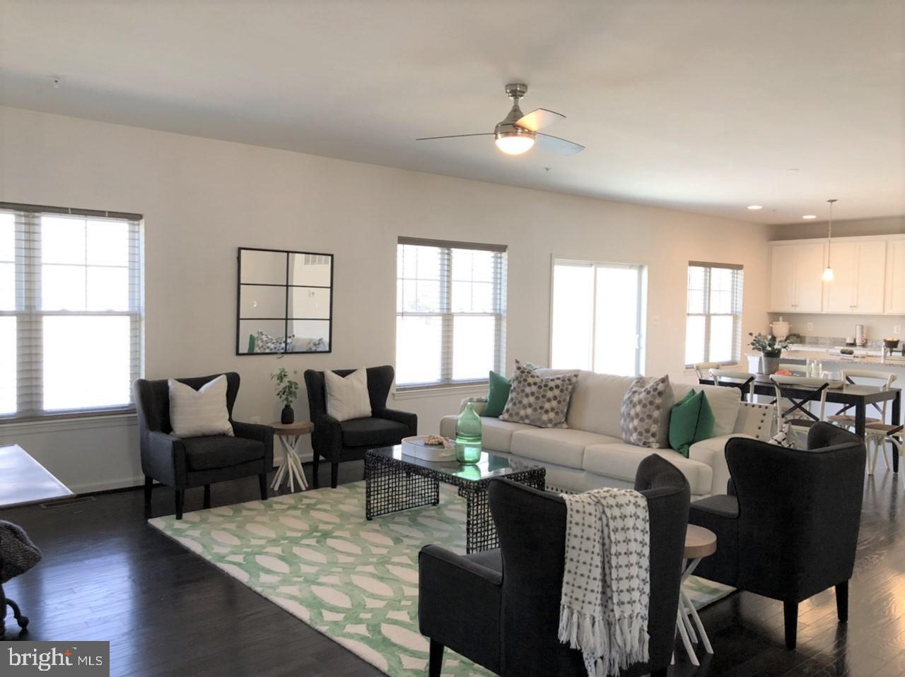 201 Featherstone Road Pasadena, MD 21122 - Photo 7 of 19 a living room with furniture and wooden floor