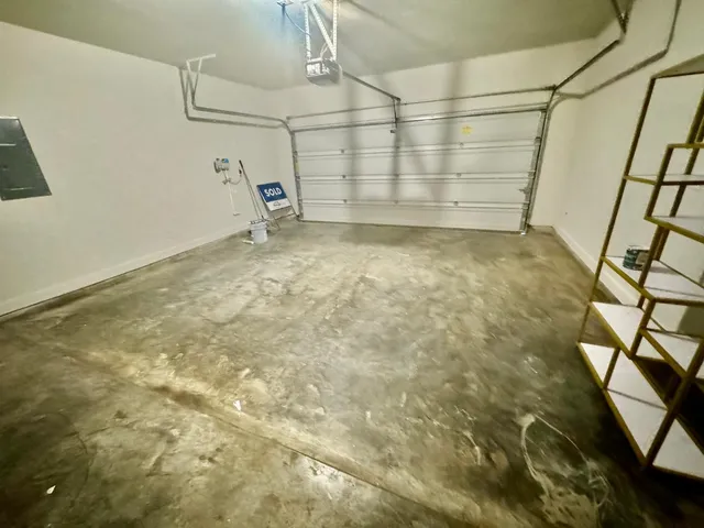 a kitchen with granite countertop a sink a counter top space and cabinets