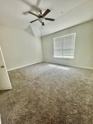 a bathroom with a sink vanity granite and a mirror