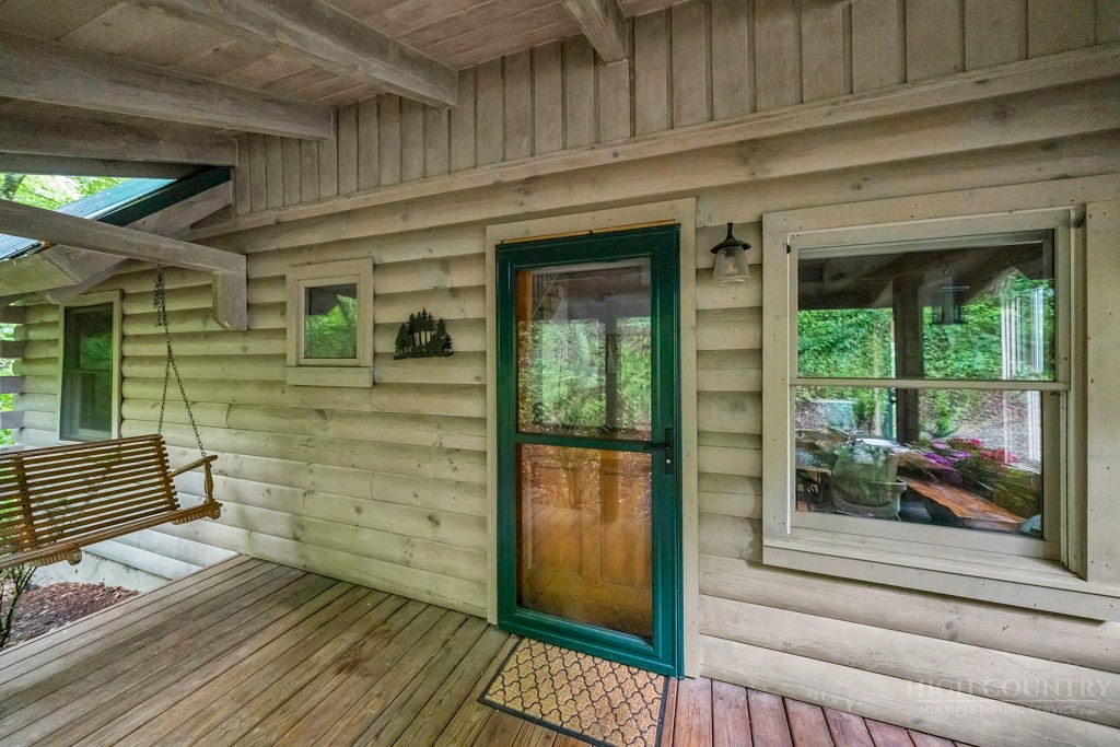 192 Dewitt Barnett Road Vilas, NC 28692 - Photo 4 of 32 a view of front door of house with wooden floor