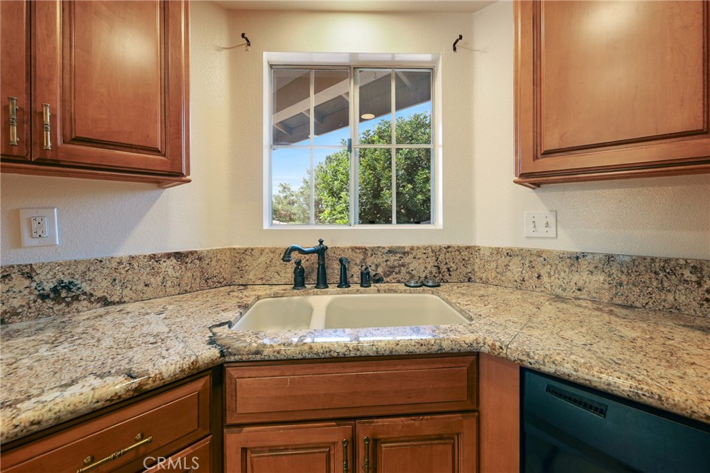 14 Abrigo Rancho Santa Margarita, CA 92688 - Photo 13 of 40 a kitchen with granite countertop sink and cabinets