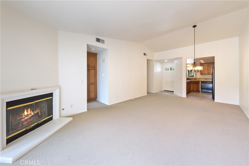 14 Abrigo Rancho Santa Margarita, CA 92688 - Photo 9 of 40 a view of empty room with a fireplace and window