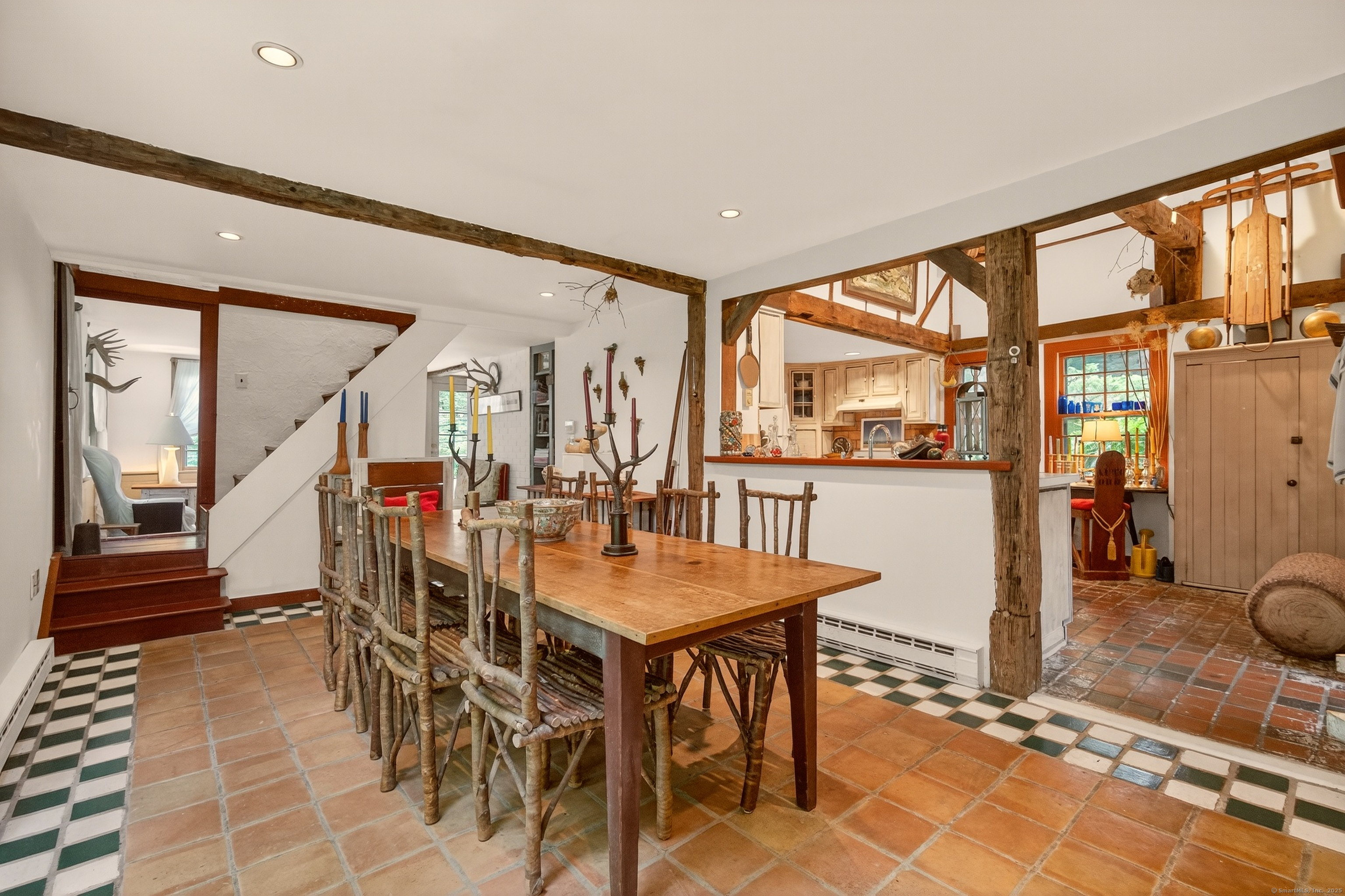 50 Southbury Road Roxbury, CT 06783 - Photo 13 of 31 a view of a dining room and livingroom with furniture wooden floor and a rug