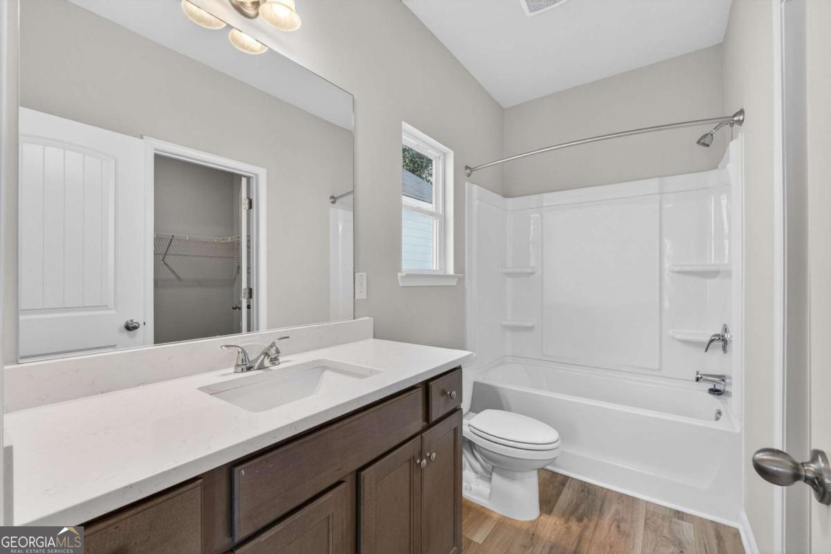 205 Riverview Road Franklin, GA 30217 - Photo 16 of 26 a bathroom with a sink a toilet and shower