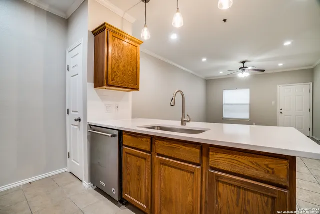 a kitchen with kitchen island a sink stainless steel appliances and window