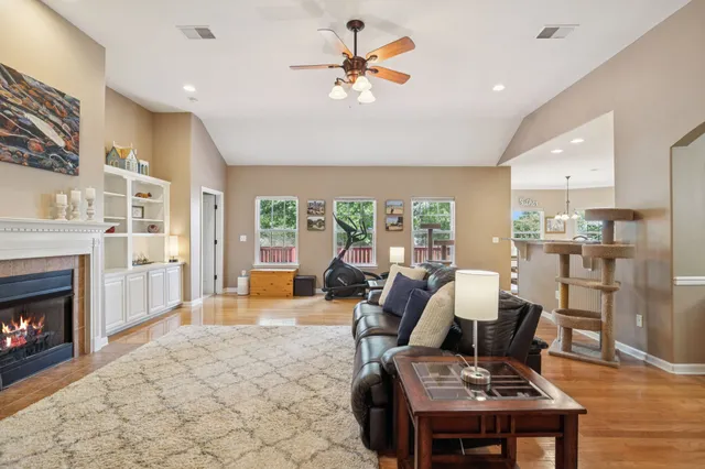 a living room with furniture and a fireplace